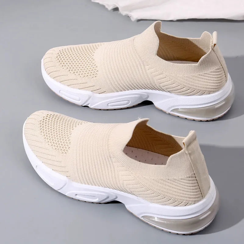 Slip-on sock shoes with mesh lining and PVC sole in black, white, pink, and khaki colours