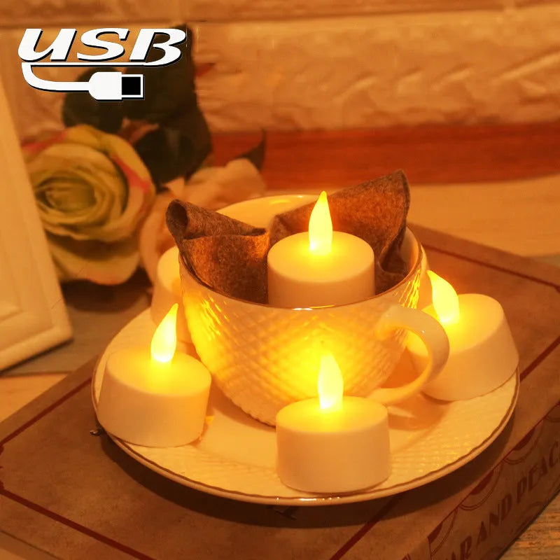 White plastic USB rechargeable LED candle lamp with flame-shaped head next to plastic cup and USB cable.