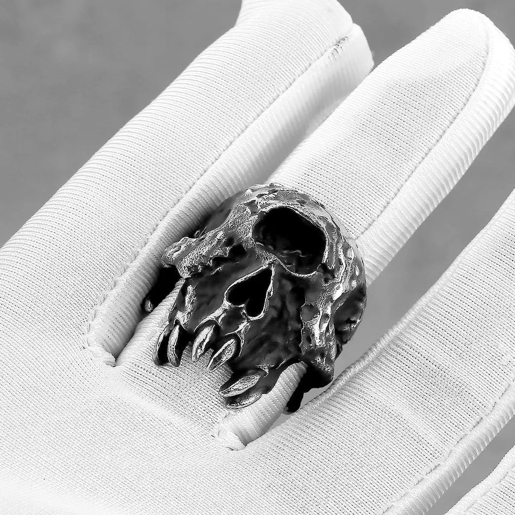 Alloy skull ring with one-eyed design and electroplated finish, shown in UK sizes 7-13 for retro punk style
