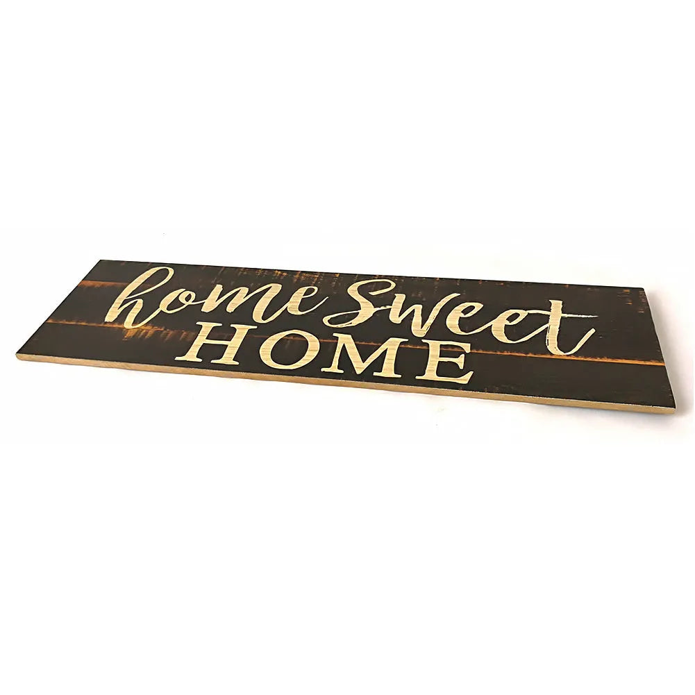 Wooden wall hanging ornament with carved design measuring 40cm by 12cm