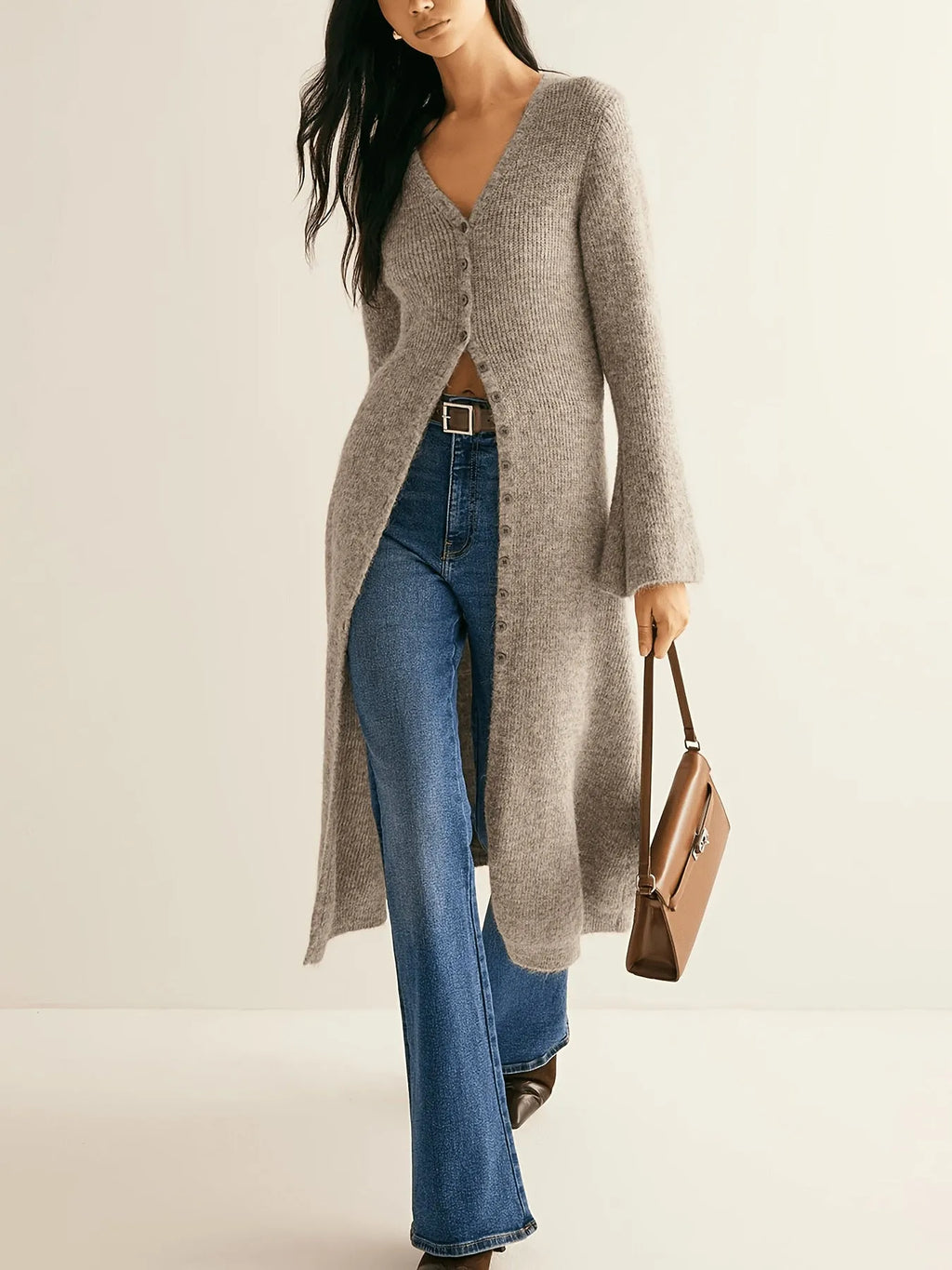 Khaki coloured women's long sleeve button-front cardigan coat on a hanger.