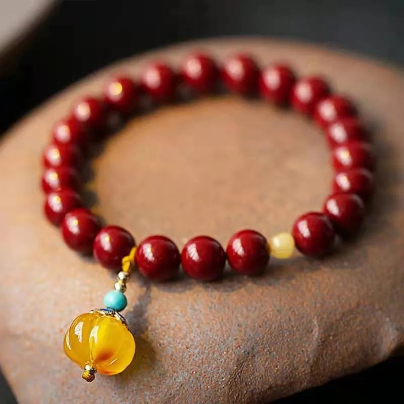 Gold cinnabar wave bracelet with solid copper beads in handcrafted national style design