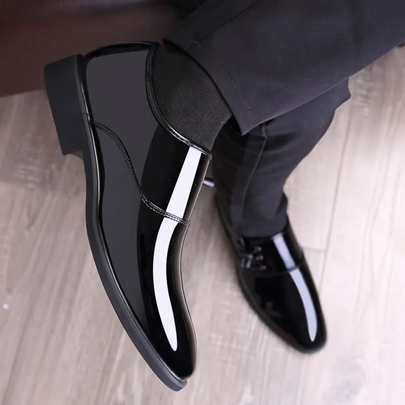 Men's black and brown formal business shoes with a square heel and round toe design on a rubber sole.