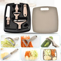 Green eight-piece kitchen tool set with peeler, cutter, and wheat straw chopping board on a counter.