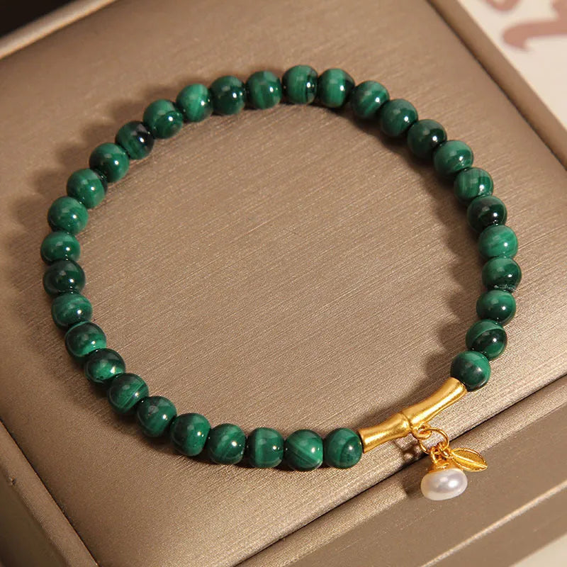 White crystal lucky bamboo bracelet for women with a high-rise design on a wrist.