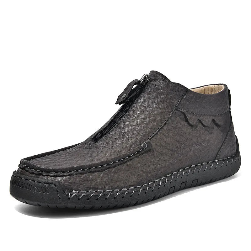 Men's slip-on loafers in black with round toe, low heel, and sewing thread details on PU upper