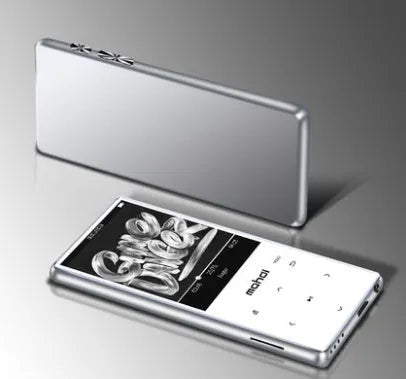 Black portable MP3 player with 2.4-inch touch screen showing music playlist, placed on a desk