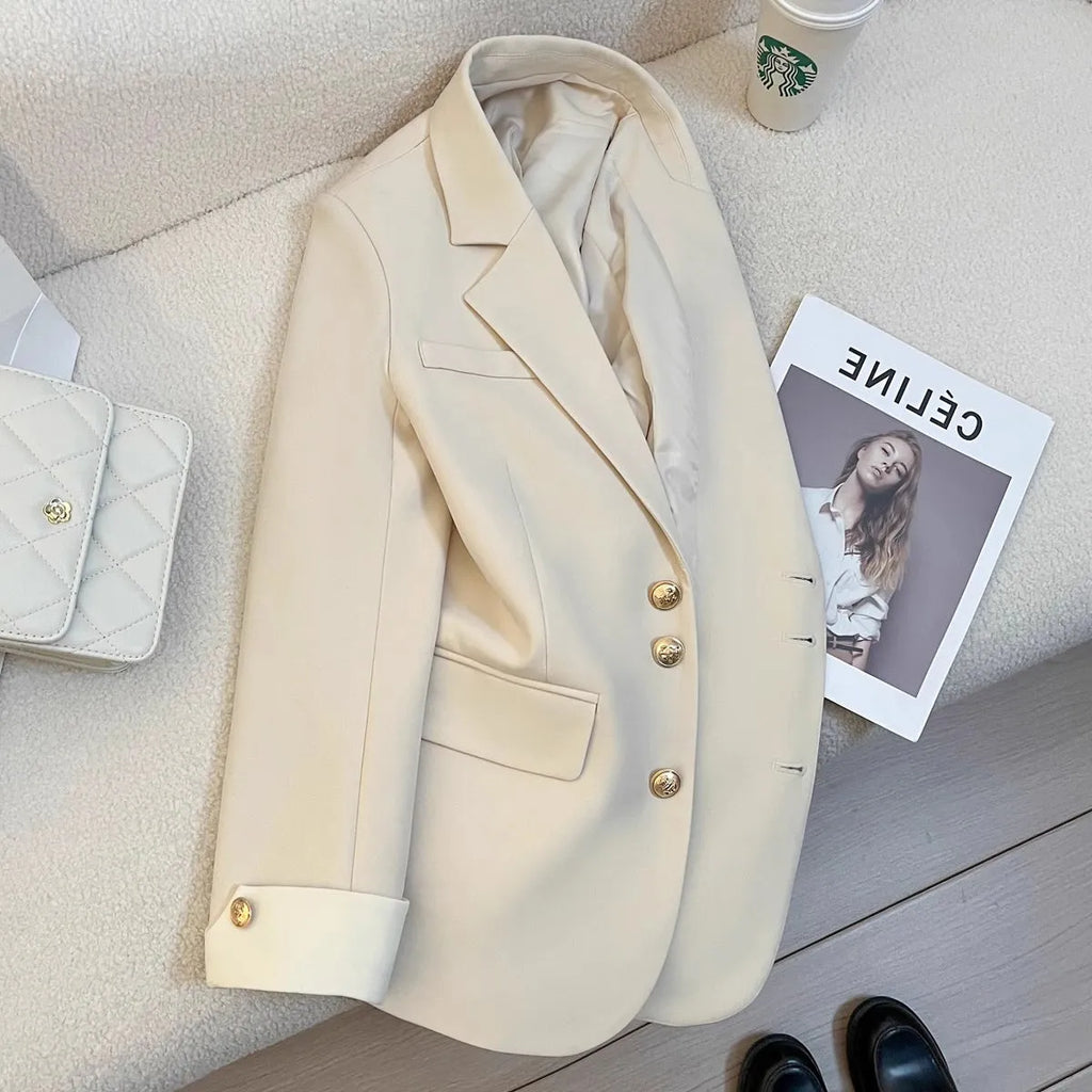 Women's Korean-style coat in solid colour with loose fit, 65cm length, and pockets for commuting wear.