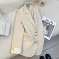 Women's Korean-style coat in solid colour with loose fit, 65cm length, and pockets for commuting wear.