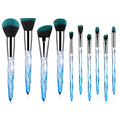 10 clear crystal foundation brushes with diamond shank handles and synthetic bristles arranged in set