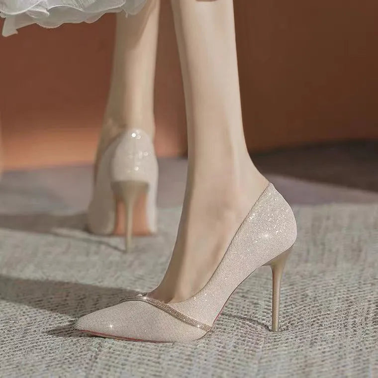 Gold and black women's stiletto high heels with pointed toe, shown in 6cm and 9cm heel options.
