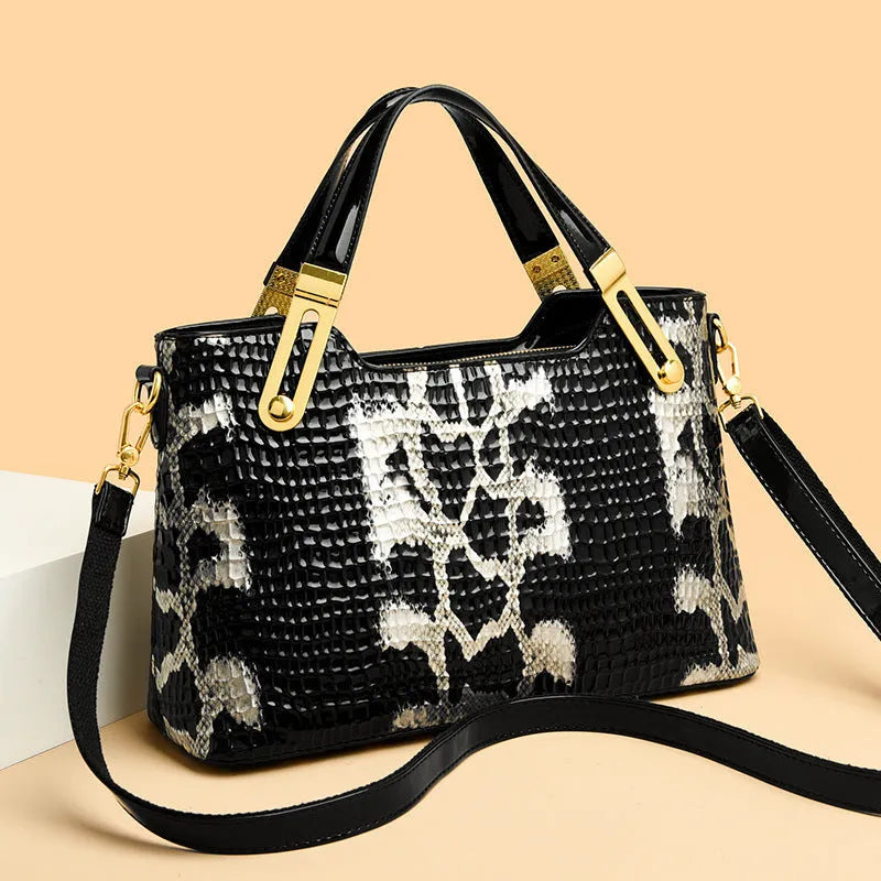 Black retro style messenger bag with chain detail showing internal phone pocket and file compartment