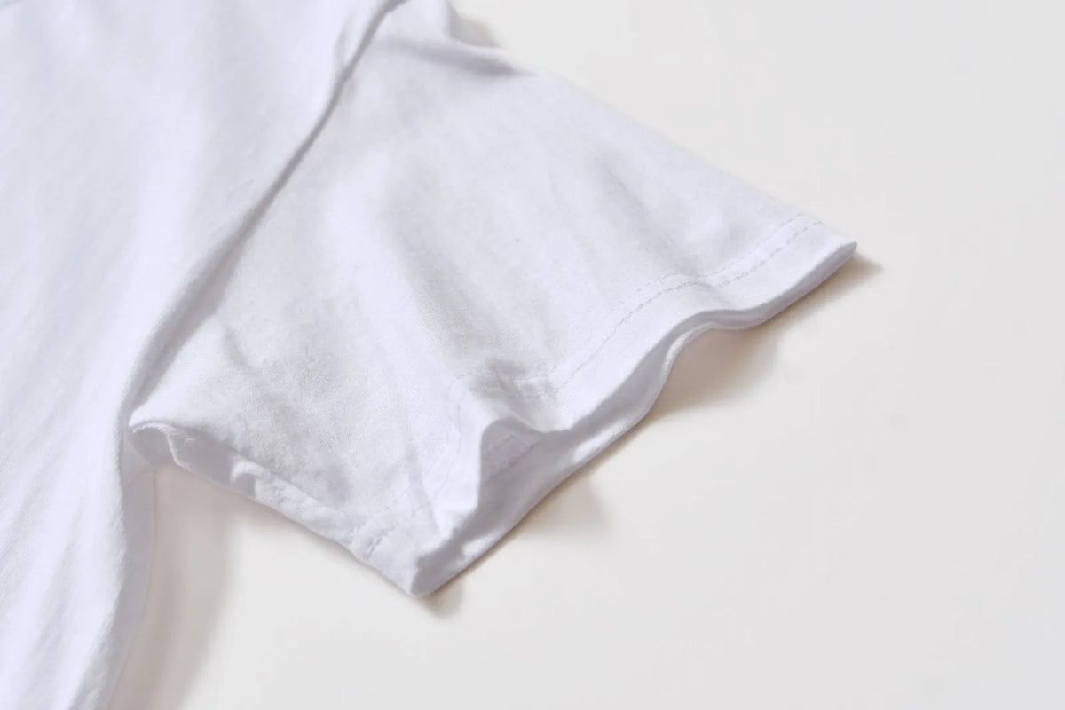White cotton t-shirt overalls with round neck and short sleeves in patterned design