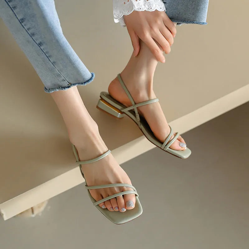 Women's flat strap gladiator sandals with square toe and adjustable ankle ties in beige.