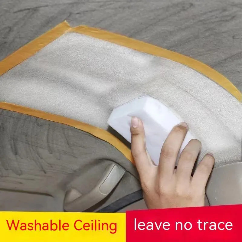 Bottle of enzyme-based fabric ceiling cleaner with towel and sponge wipes on a car roof