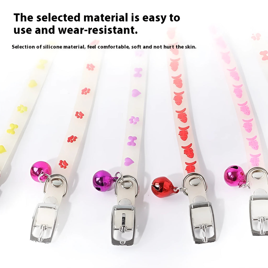 Luminous cat collar with a metal bell on an adjustable 29cm silicone strap, showing paw print design.