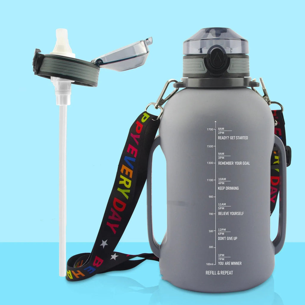 Large black collapsible silicone sports water bottle shown full and folded next to a backpack.