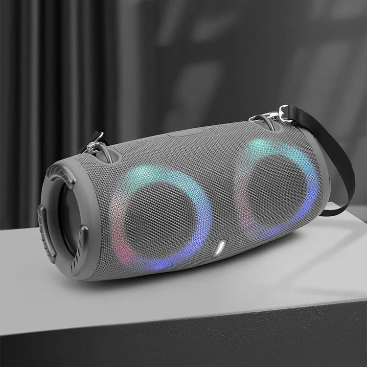 War Drum Bluetooth speaker with RGB lights in black colour, showing strap and button controls for portable outdoor audio