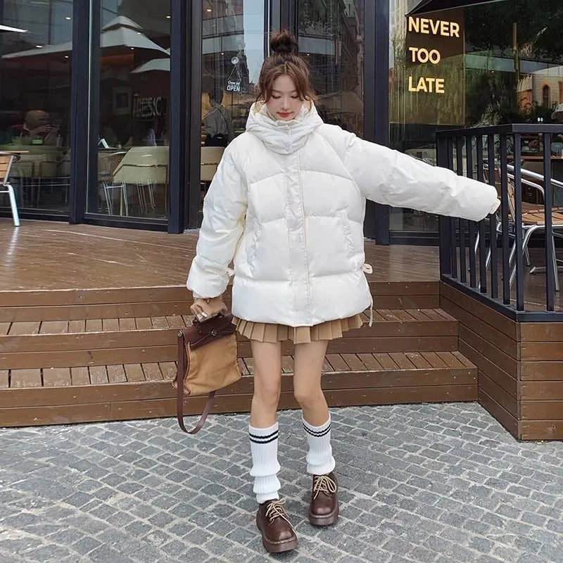 Milky white women's sleeveless loose cotton-padded jacket with princess sleeves on a hanger.