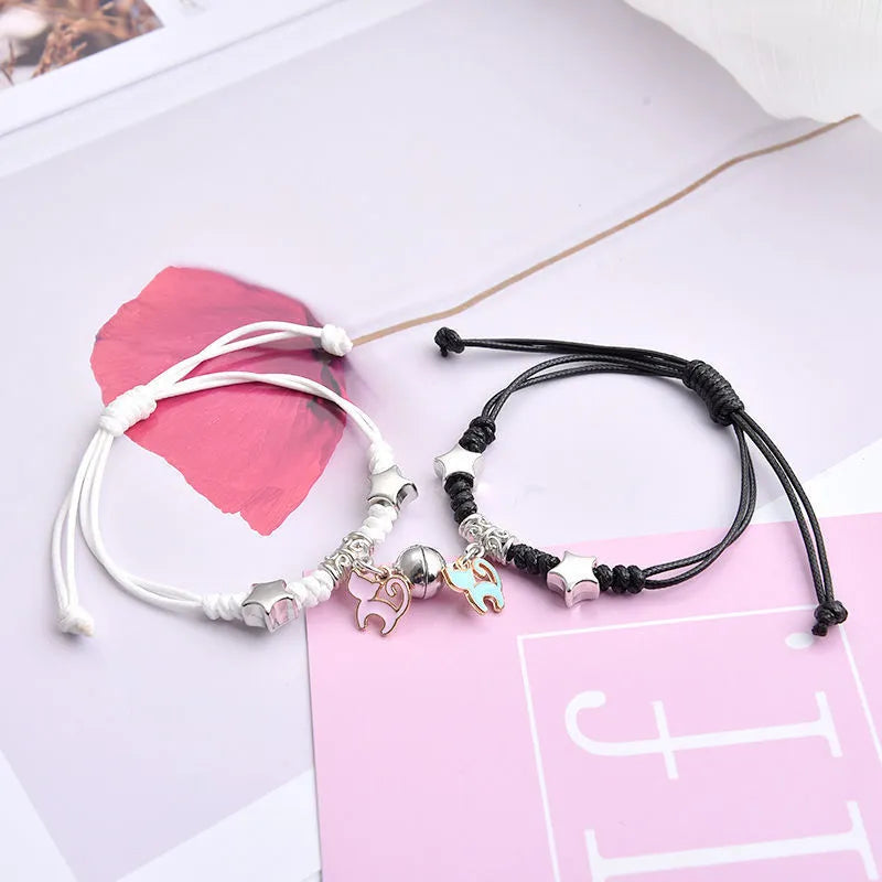 Pair of adjustable alloy bracelets with magnetic clasp showing detailed design of Crown and Clover styles