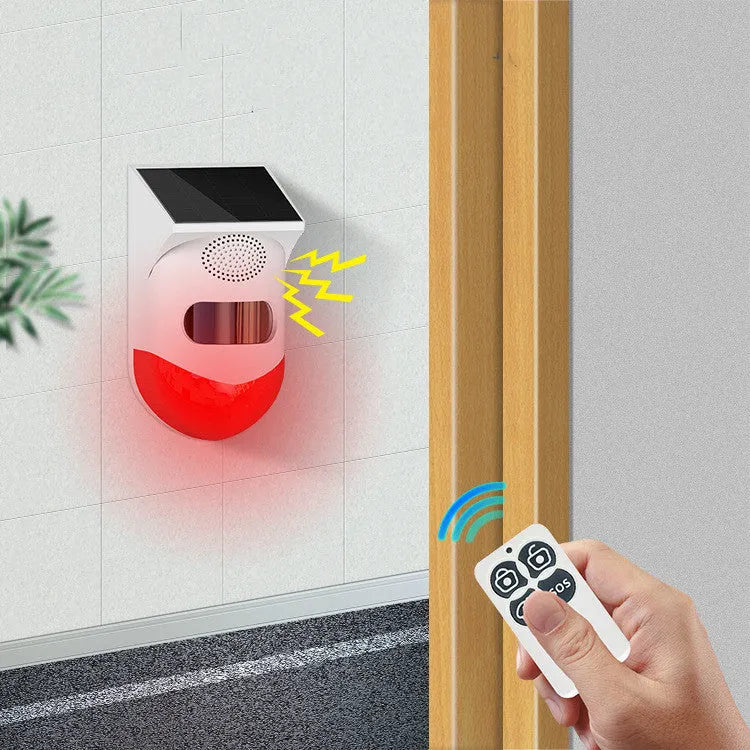 Solar-powered infrared alarm with wall mount for outdoor security detection up to 12 metres
