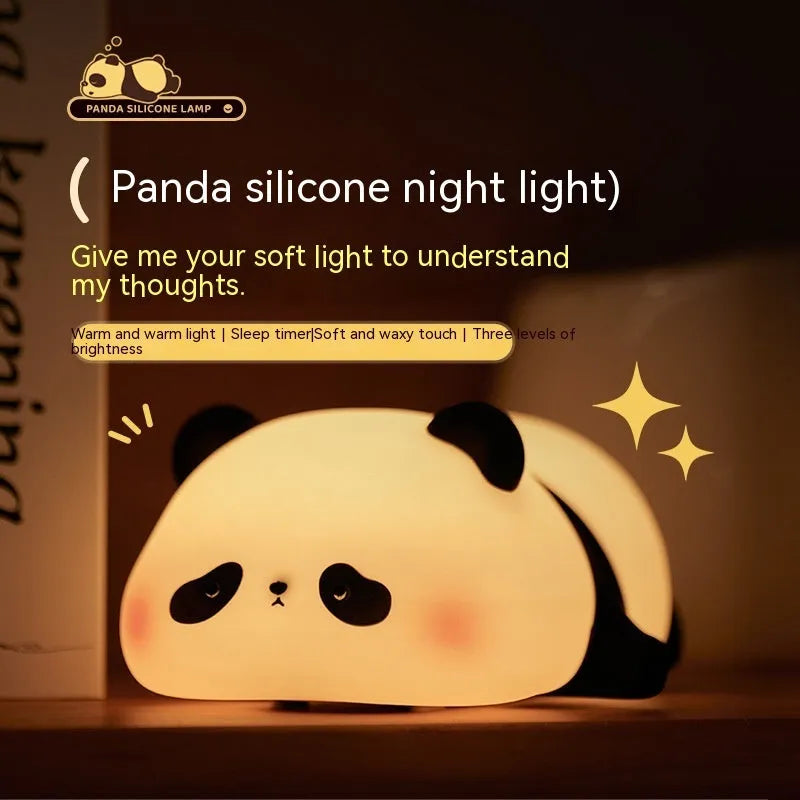Panda-shaped night light with soft silicone surface, measuring 150x130x80mm, showing warm white glow