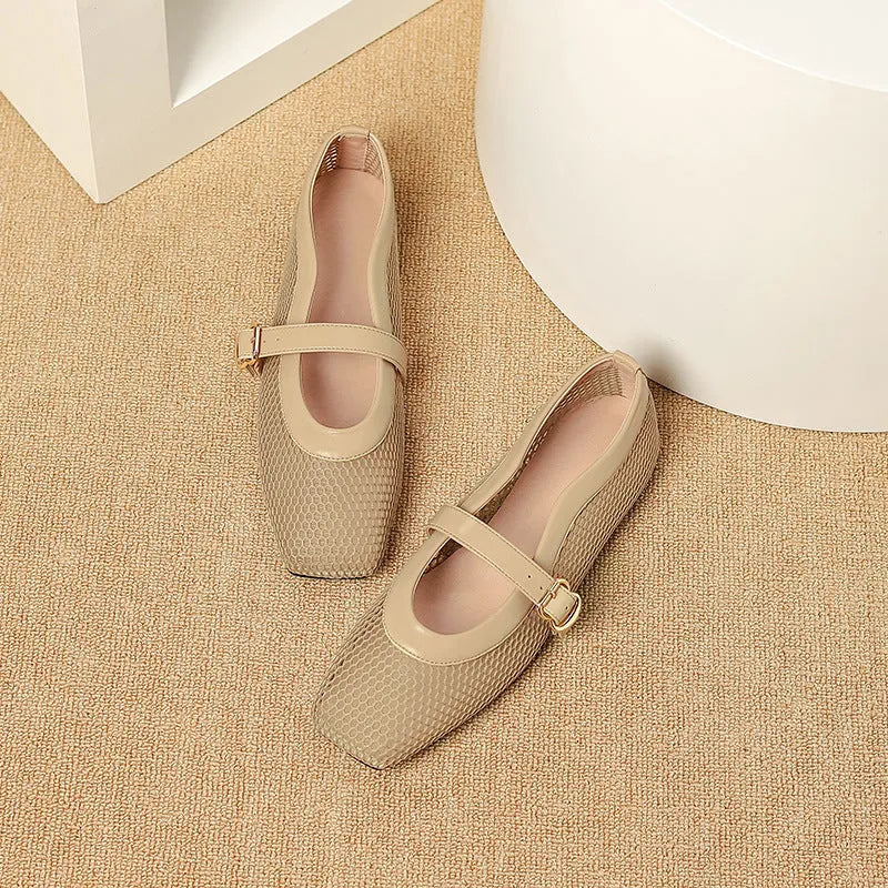 Women's beige mesh summer hiking pumps with a buckle and flat heel on a plain background.