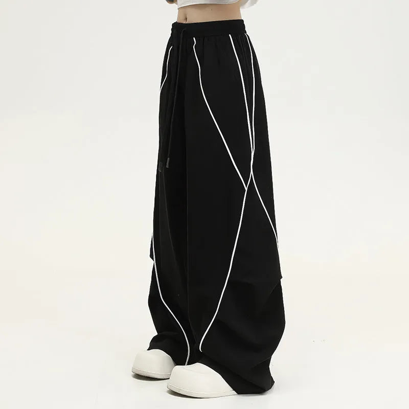 Black pleated wide-leg sports trousers with striped pattern and mid-waist design