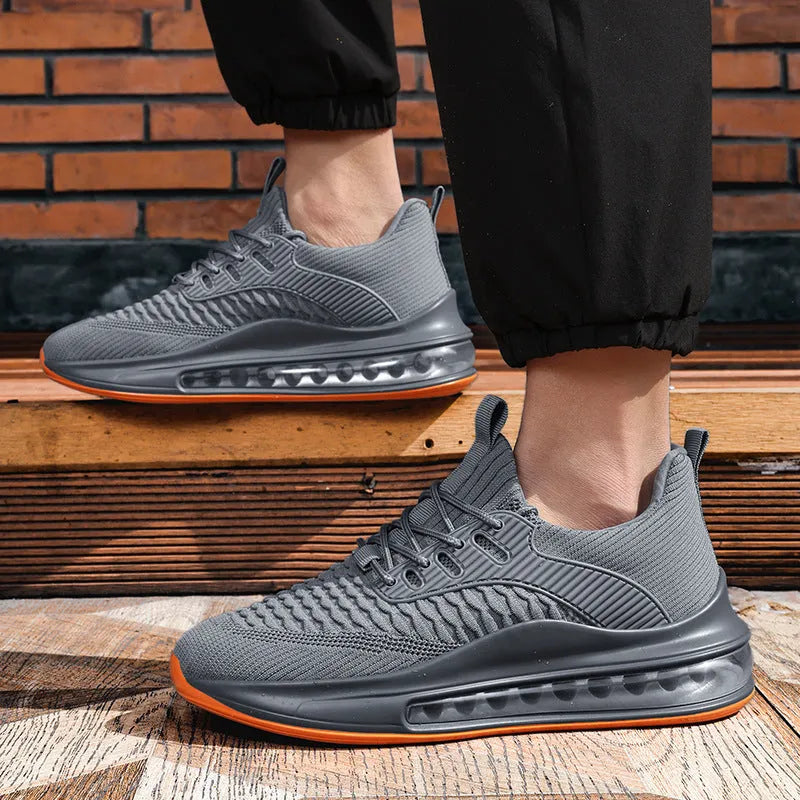 Black low-top mesh running sneakers with rubber sole, showing breathable construction and lace-up front