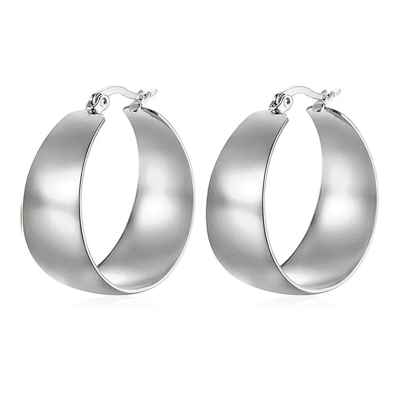 Widened curved stainless steel earrings in gold or steel colour, available in 25mm or 30mm sizes