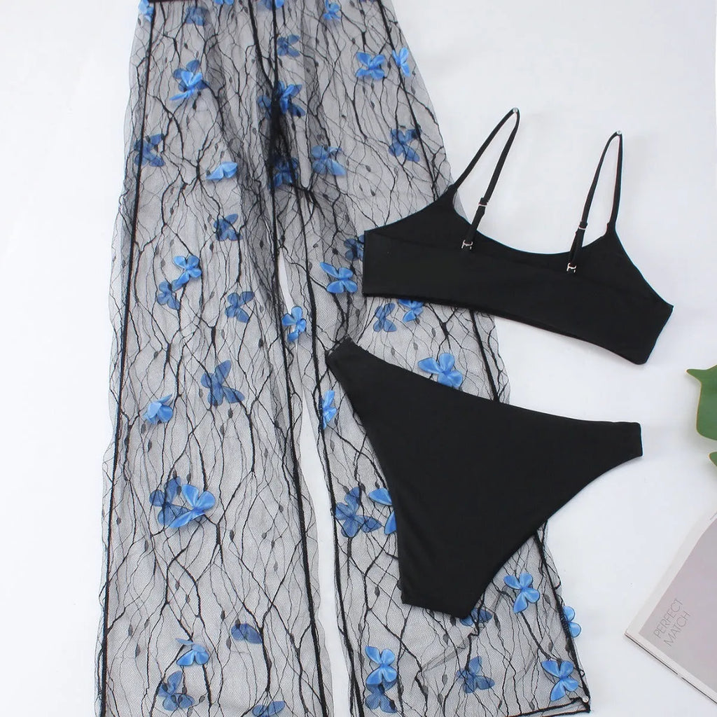 Black women's bikini set with butterfly embroidery showing top, underwear and pants pieces