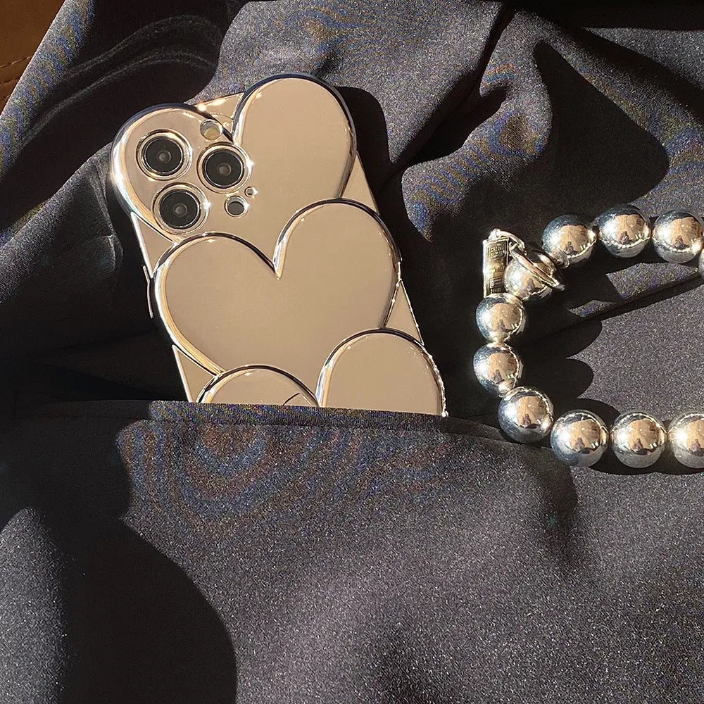 Soft TPU iPhone case with a shiny, three-dimensional electroplated love design on the back.