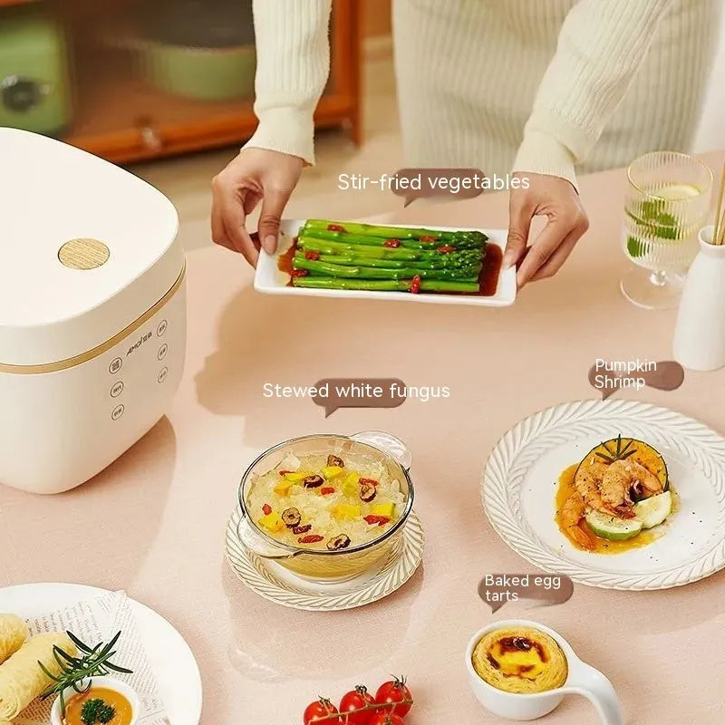 White and beige plastic multi-function 3-litre rice cooker with black inner pot and accessories.