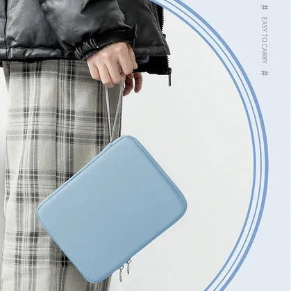 Imitation leather tablet protective case with a carrying handle in black, light grey, pink, or sky blue.