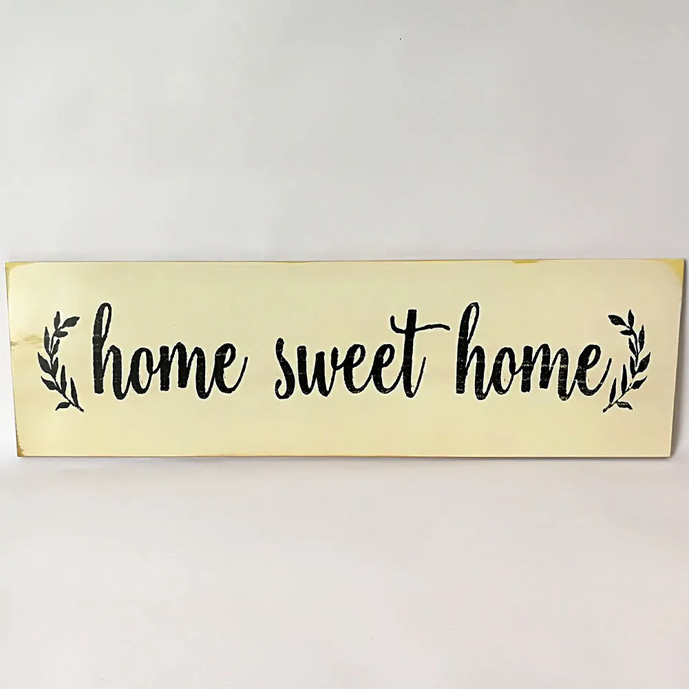 Wooden wall hanging ornament with carved design measuring 40cm by 12cm