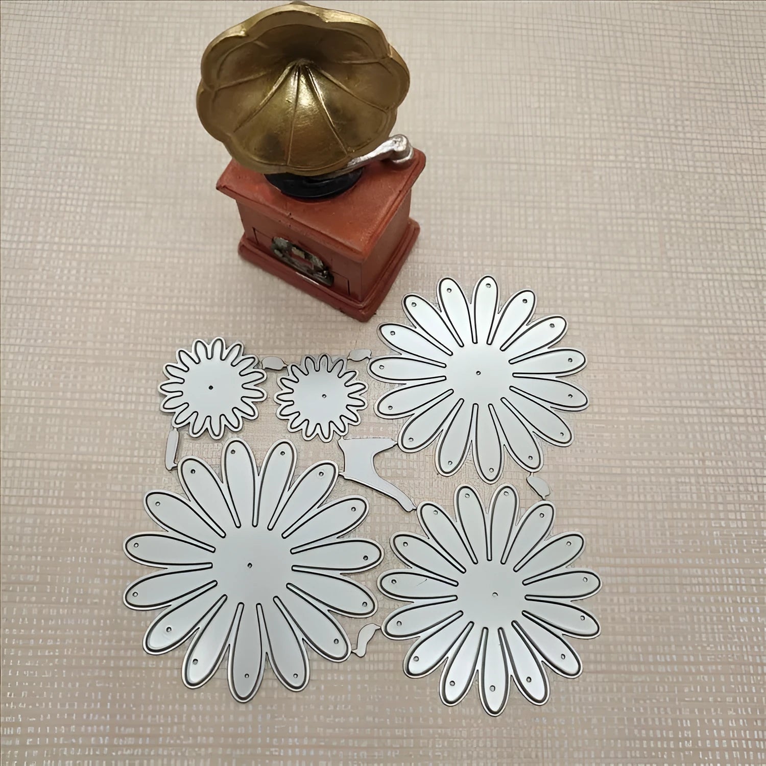 Silver floral design metal cutting die with hanging hook, 12.5cm by 13cm.