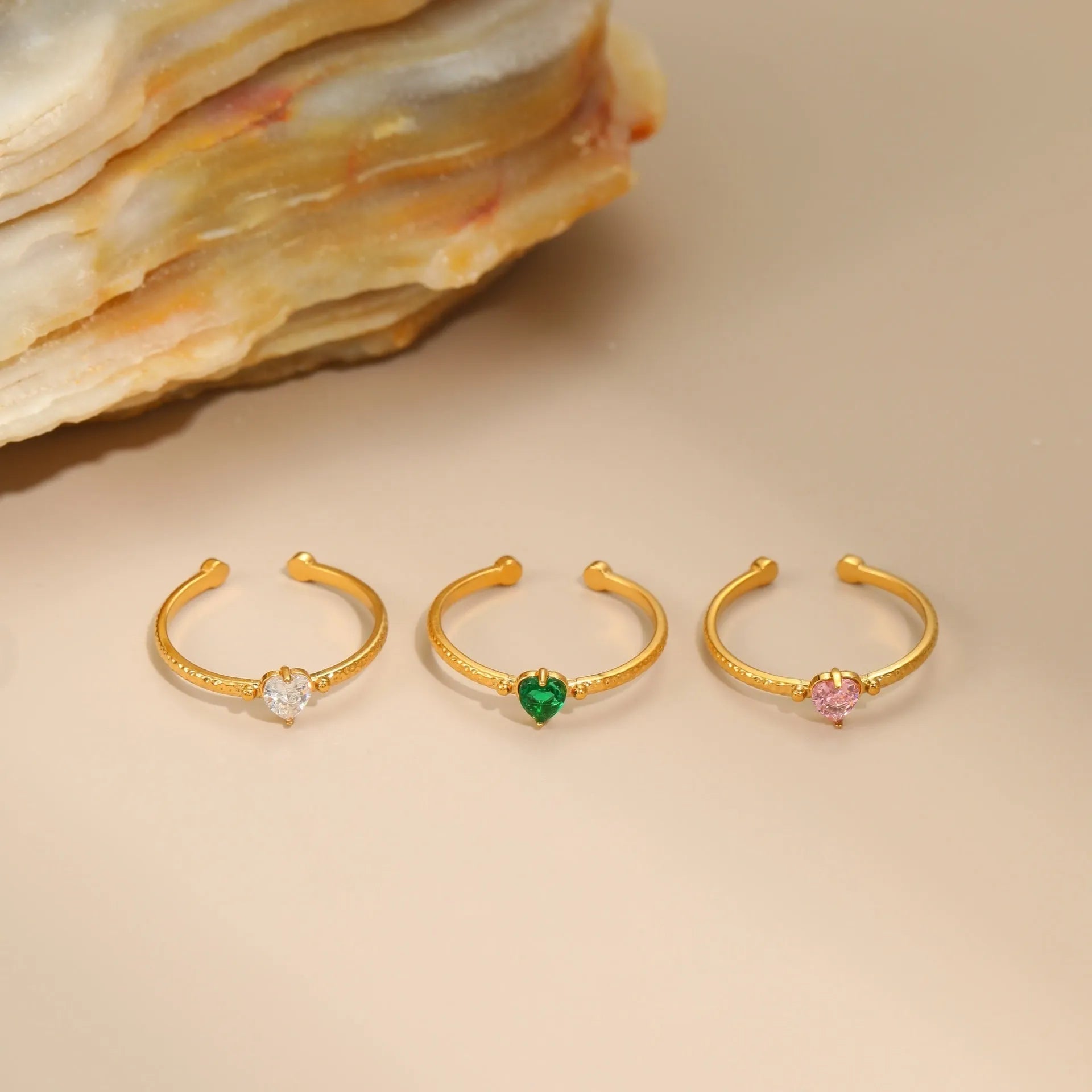 Open ended heart ring with zircon stones in stainless steel, showing adjustable free size design