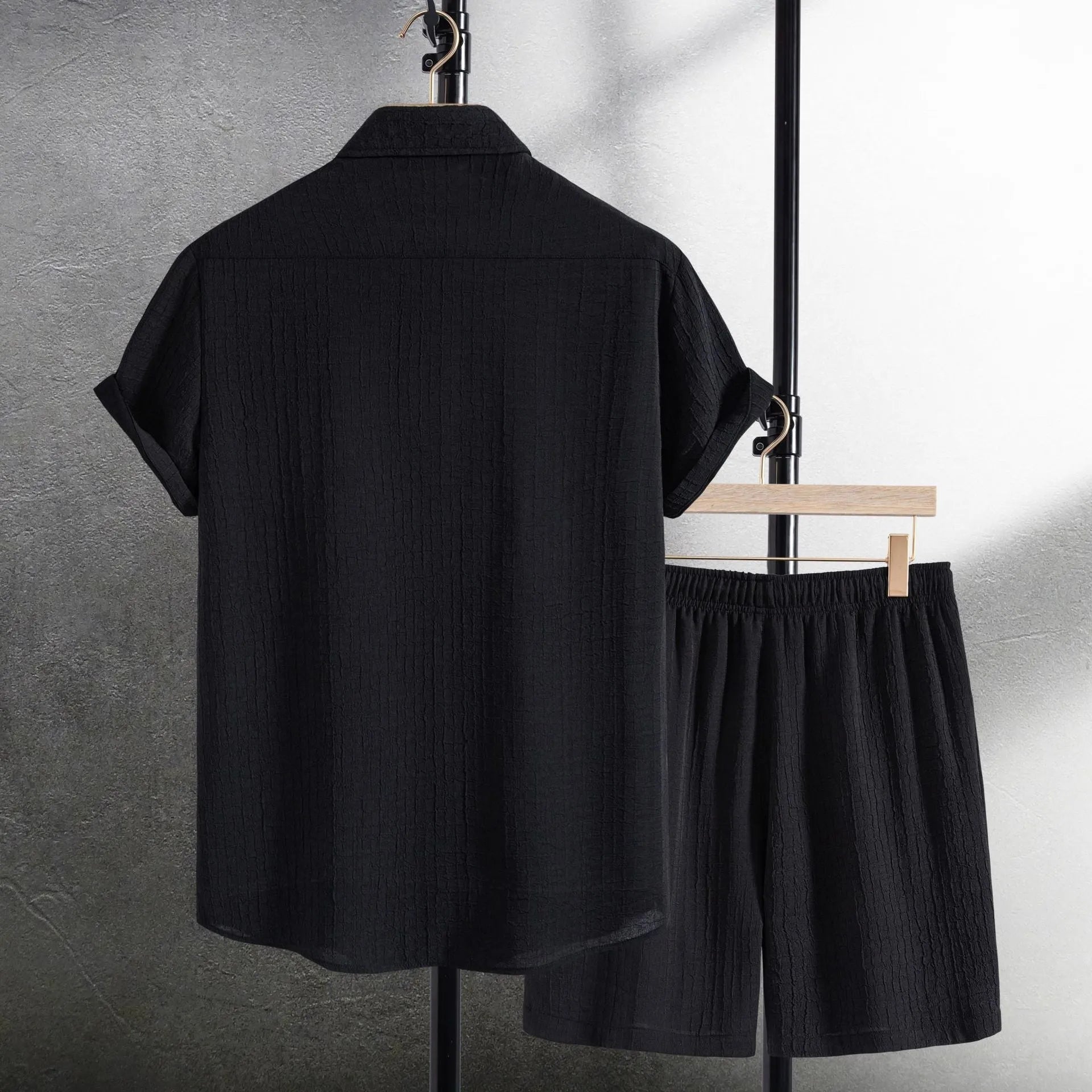Men's white cotton blend jacquard shirt and matching shorts casual suit set laid flat.
