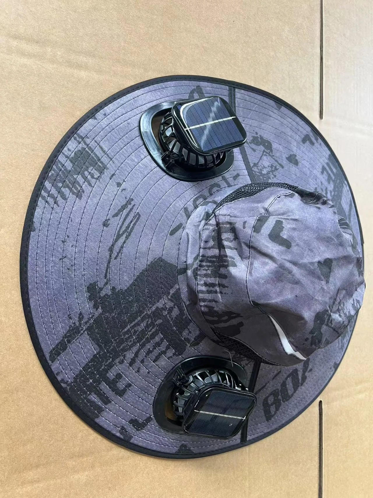 Men's grey solar fan cap with large brim and two small built-in fans on the front.