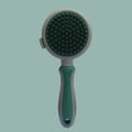 Two-sided silicone cat hair brush with retractable slicker and octopus-teethed massager in green or pink