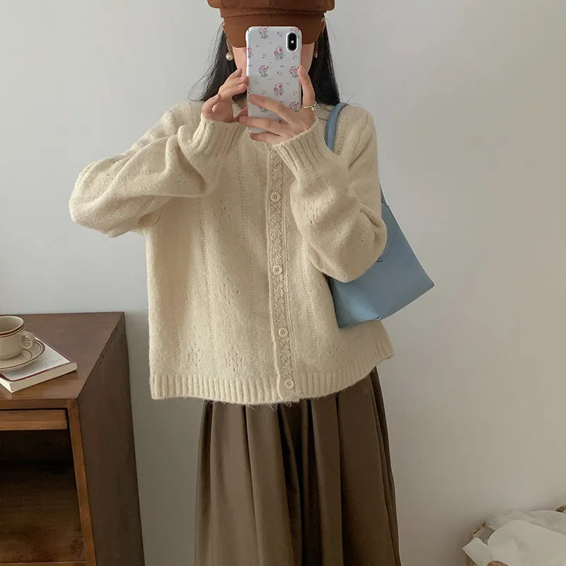 Art retro style Korean knit sweater coat cardigan in a loose free size, shown in apricot colour.