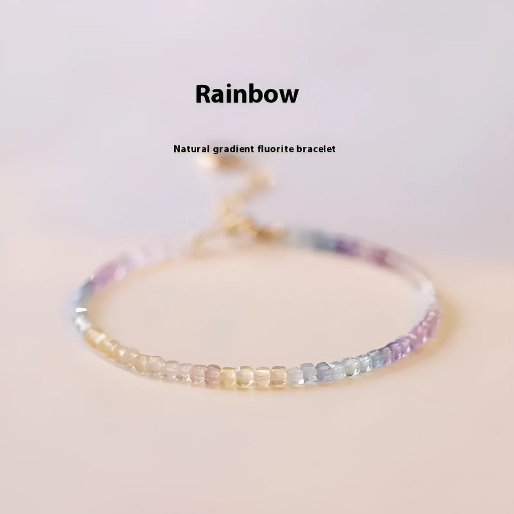 Handmade women's rainbow fluorite bracelet with copper geometric settings
