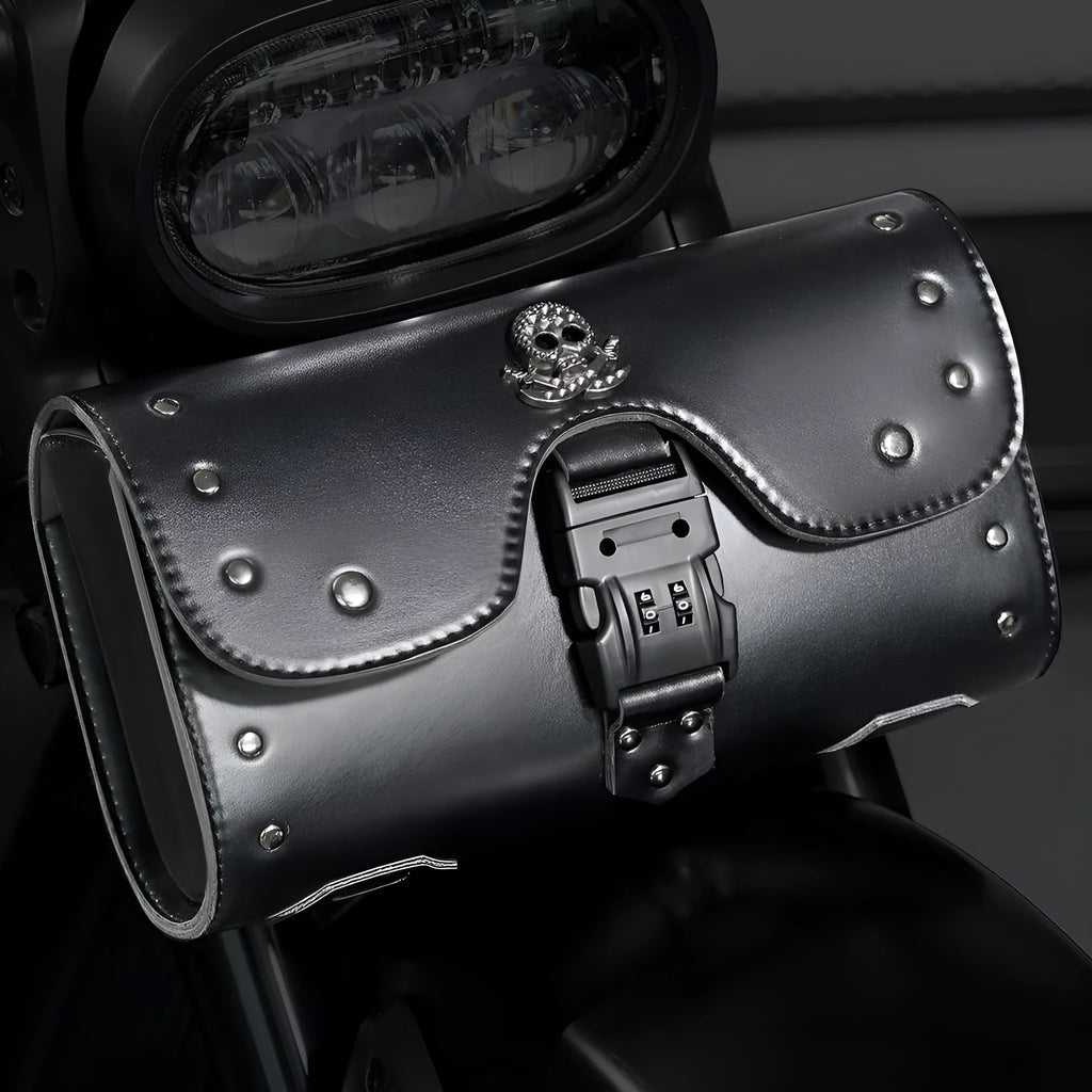 Black PU motorcycle pannier bag with punk retro styling mounted on a custom bike.