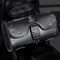 Black PU motorcycle pannier bag with punk retro styling mounted on a custom bike.
