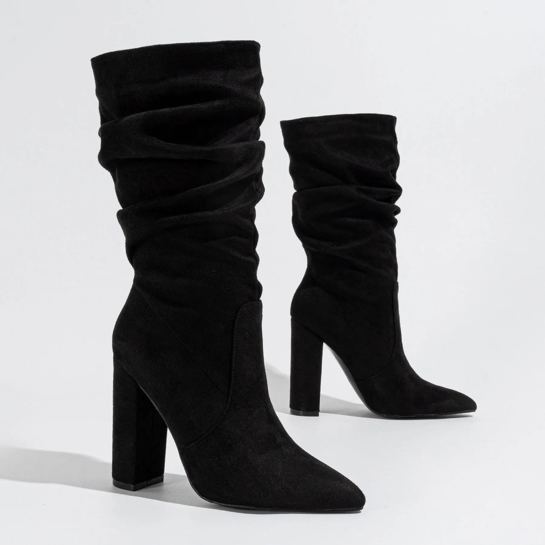 Women's chunky heel pointed-toe suede boots in black colour with 8cm+ heel height and middle calf length