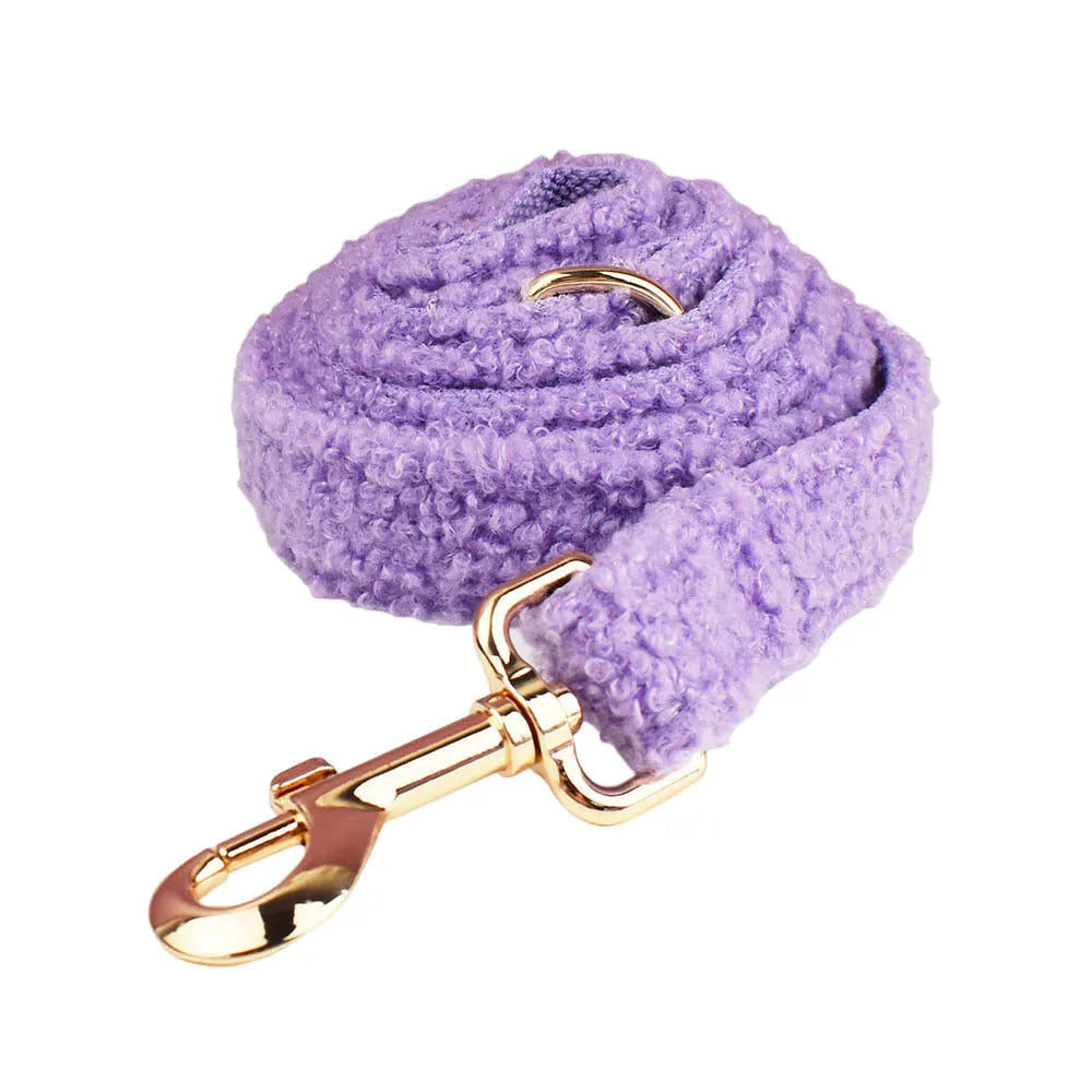 Four-piece cloth dog set showing collar, leash, bow, and vest for small to extra large dogs