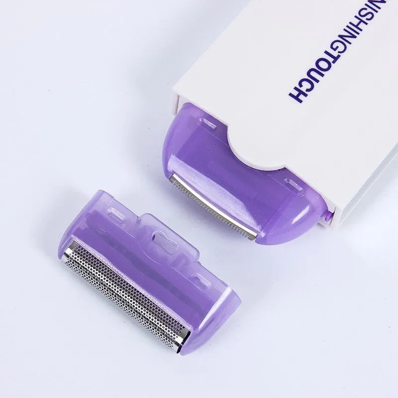 Finishing Touch electric hair removal instrument with Sensa-Light head and accessories on white background