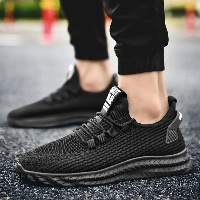 Men's summer casual shoes with flying weave upper, front tie lacing, rubber sole, available in black, coffee, grey, sizes 39-44.