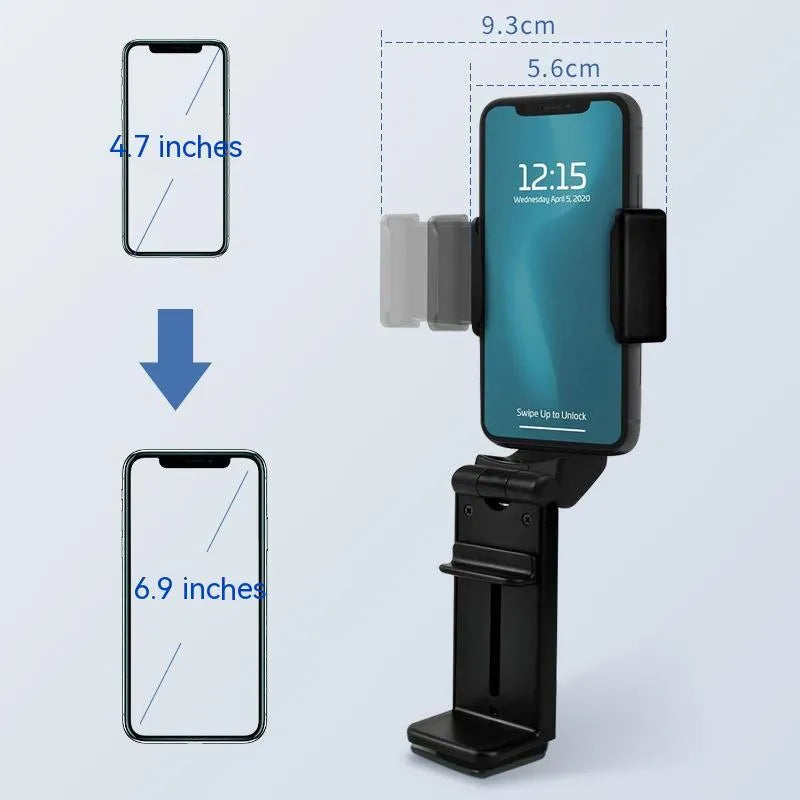 Black 360-degree rotating collapsible phone holder on desktop showing adjustable angle