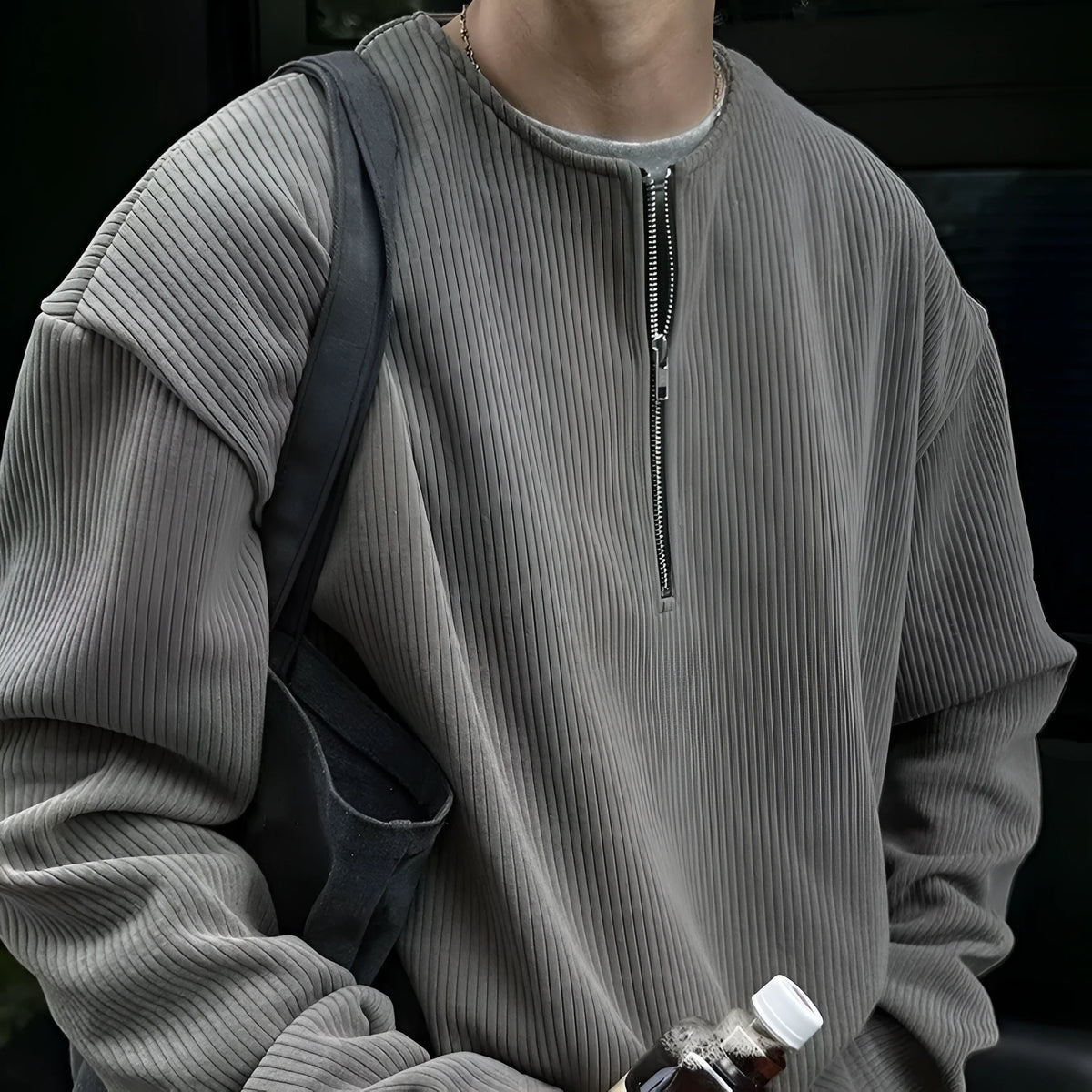Solid colour loose fit long sleeve pullover top shown in grey, black, or apricot.